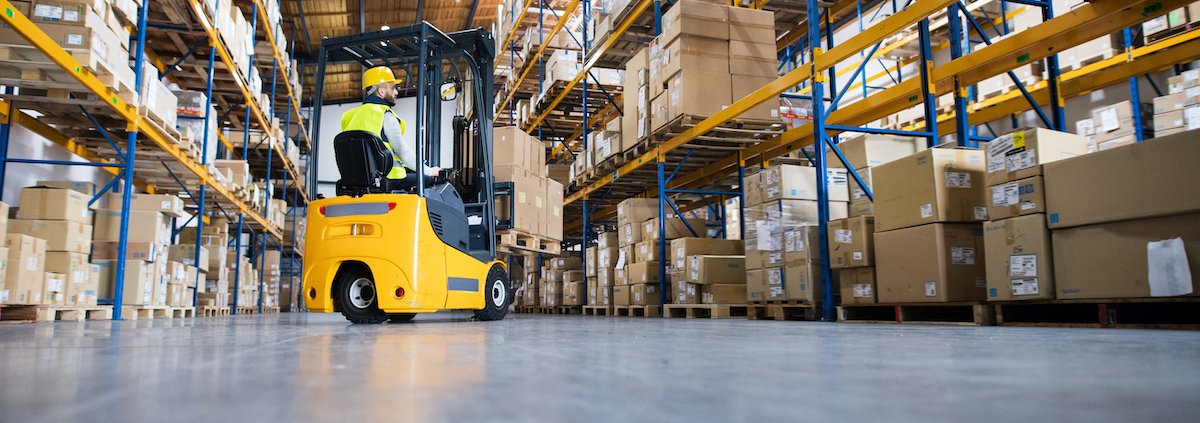 Warehouse man worker with forklift.