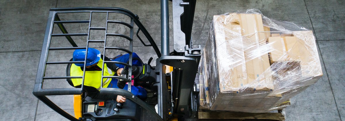 Warehouse man worker with forklift.