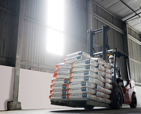 forklift driver with bags on lift