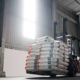 forklift driver with bags on lift